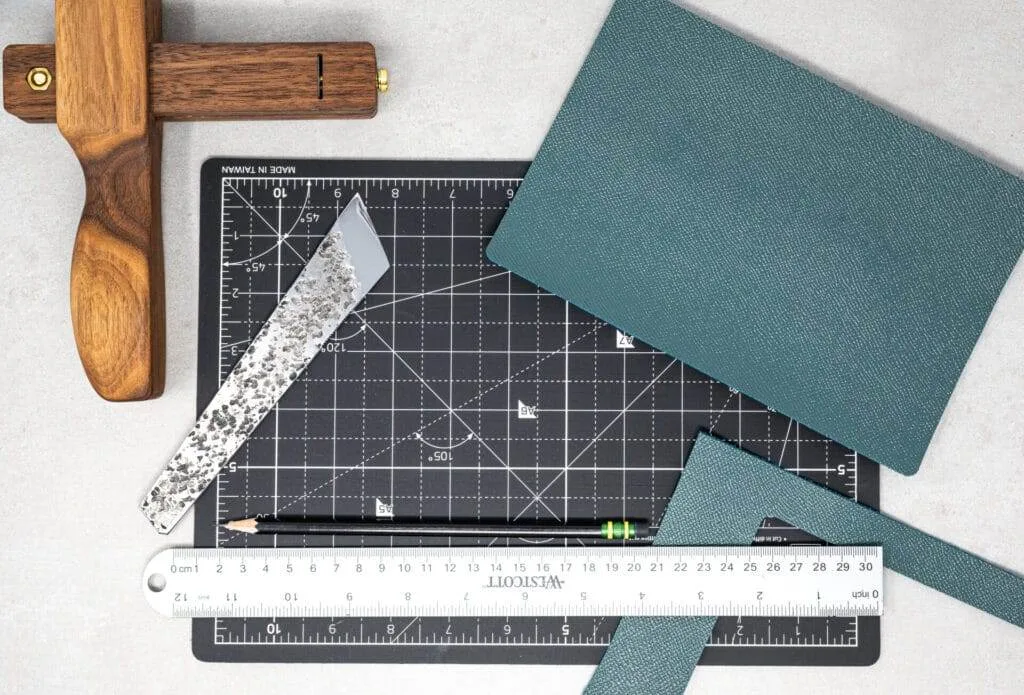 A cutting mat with a ruler and a pair of scissors subscription service.