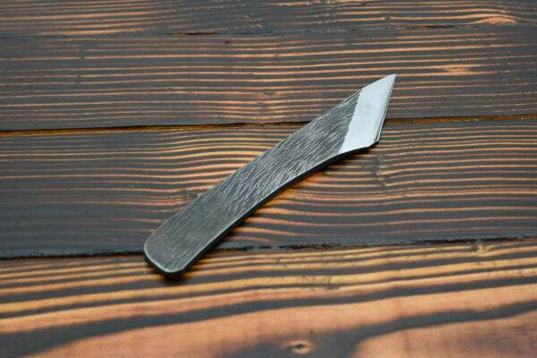 Raptor Leather Knife, wooden table