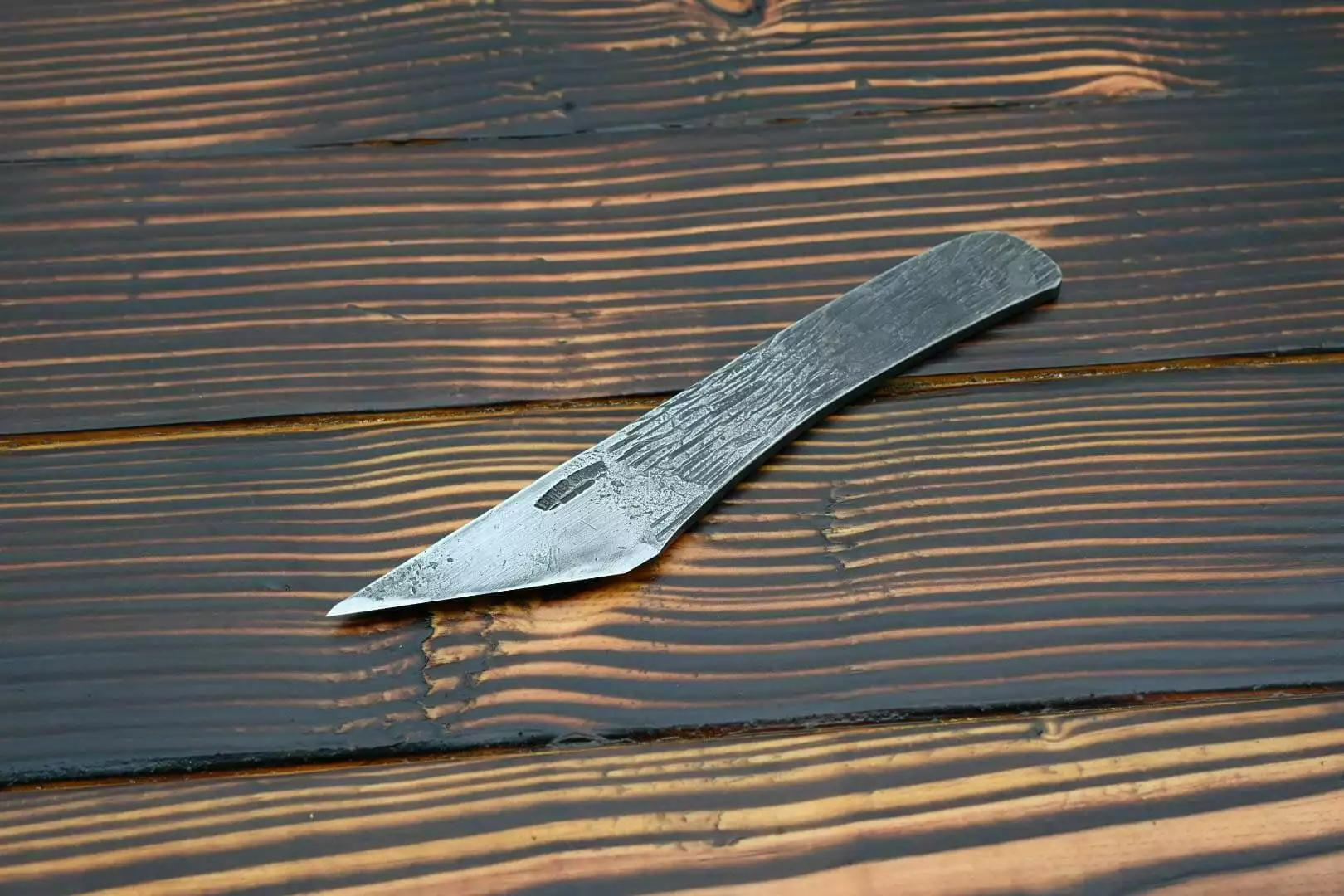 Raptor Leather Knife, wooden table