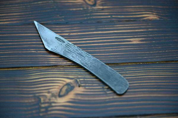 Raptor Leather Knife, wooden table.