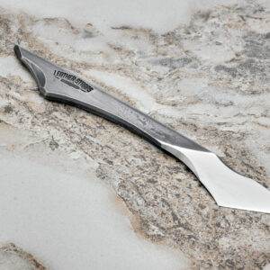 Fang Leather Knife, marble surface.