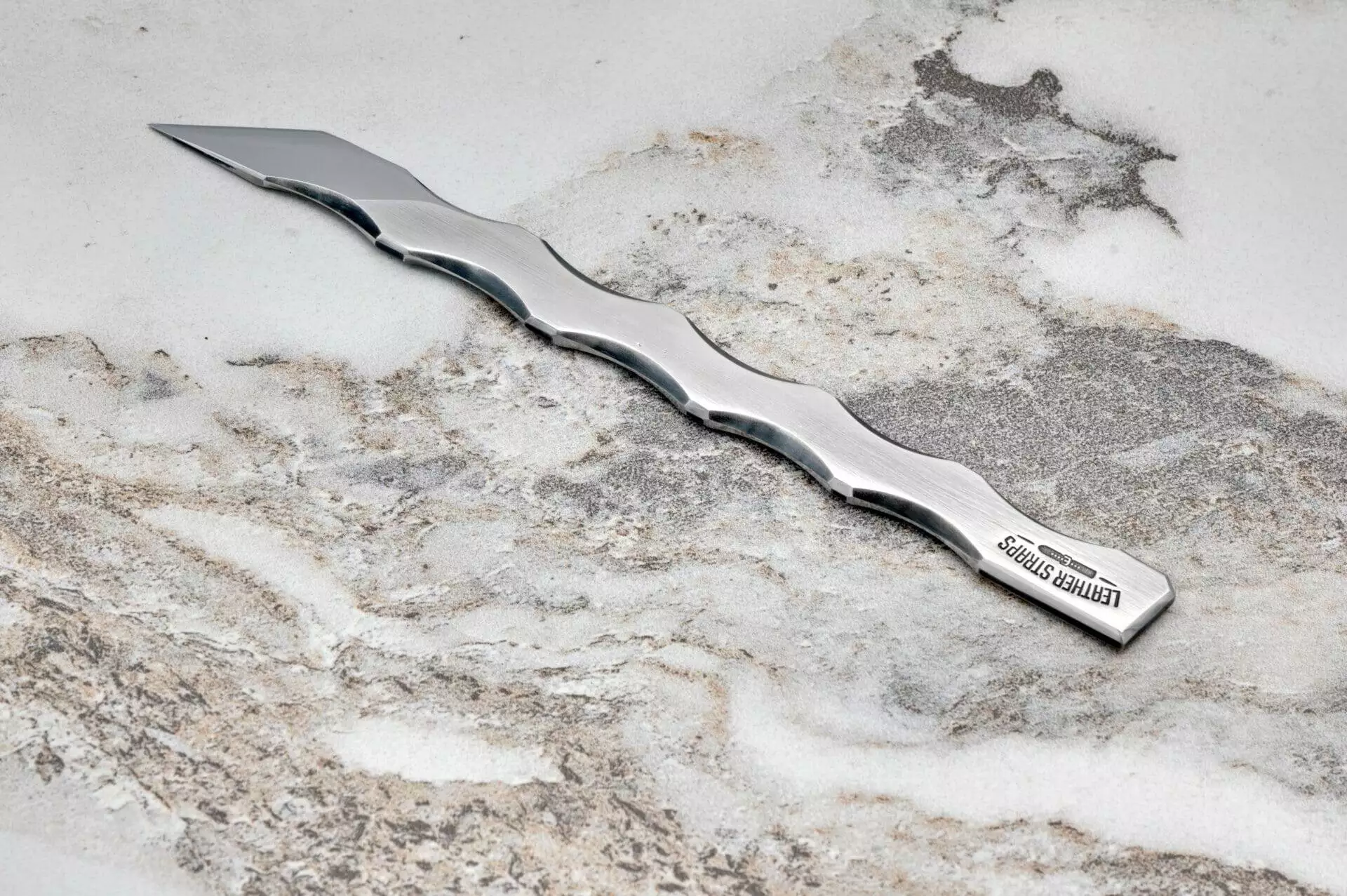 Bolt Leather Scalpel, marble surface.