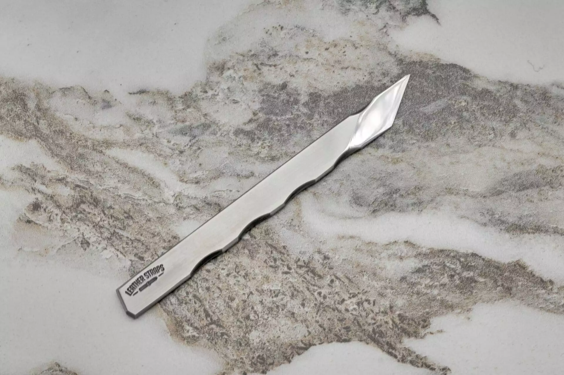 silver knife, marble surface