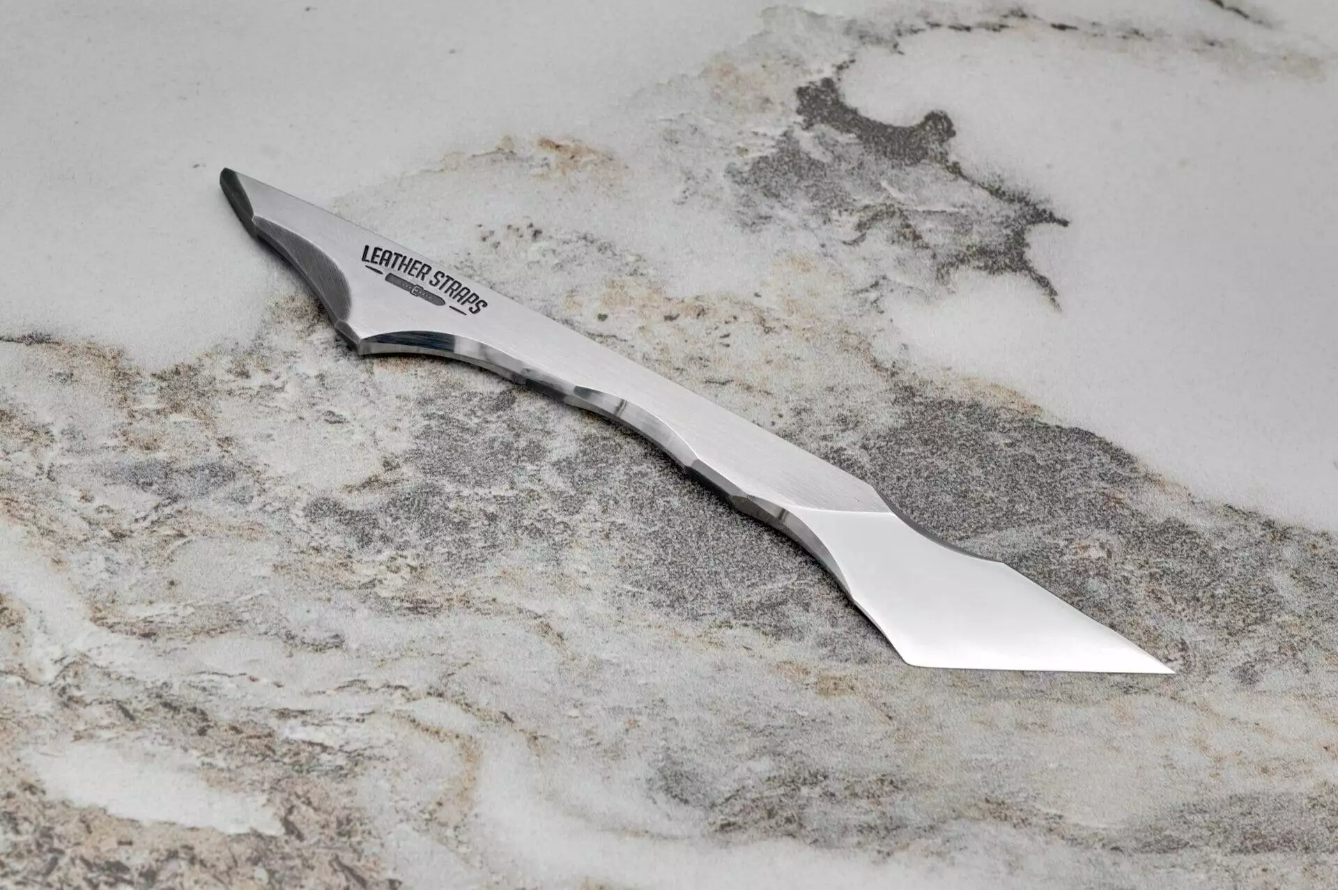 Talon Leather Knife, marble surface.