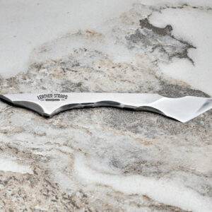 Talon Knife, marble surface.