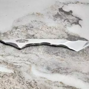 Talon Knife, marble surface.