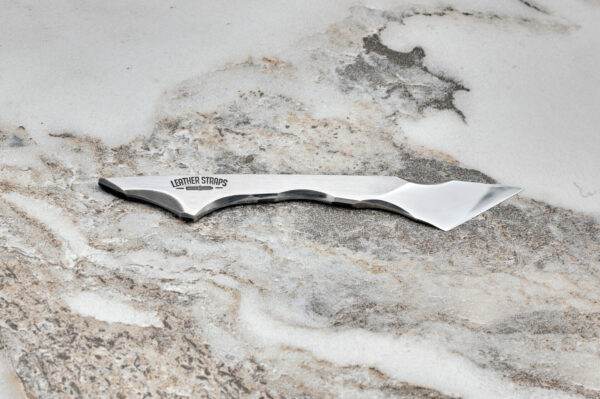 Talon Knife, marble surface.