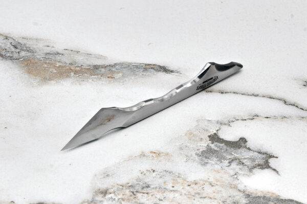 Talon Leather Knife, marble surface.