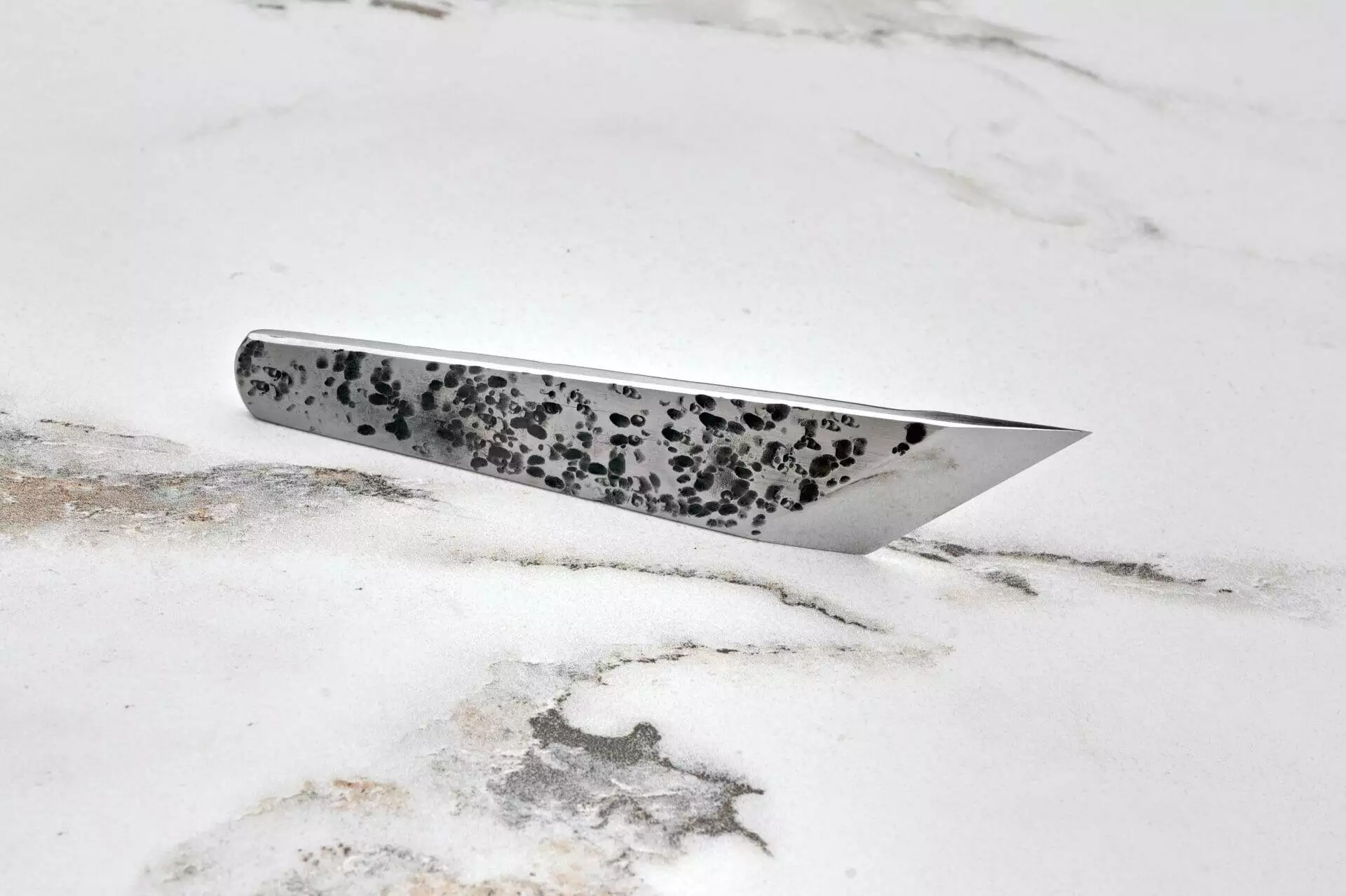 Angled Skiver, marble surface.