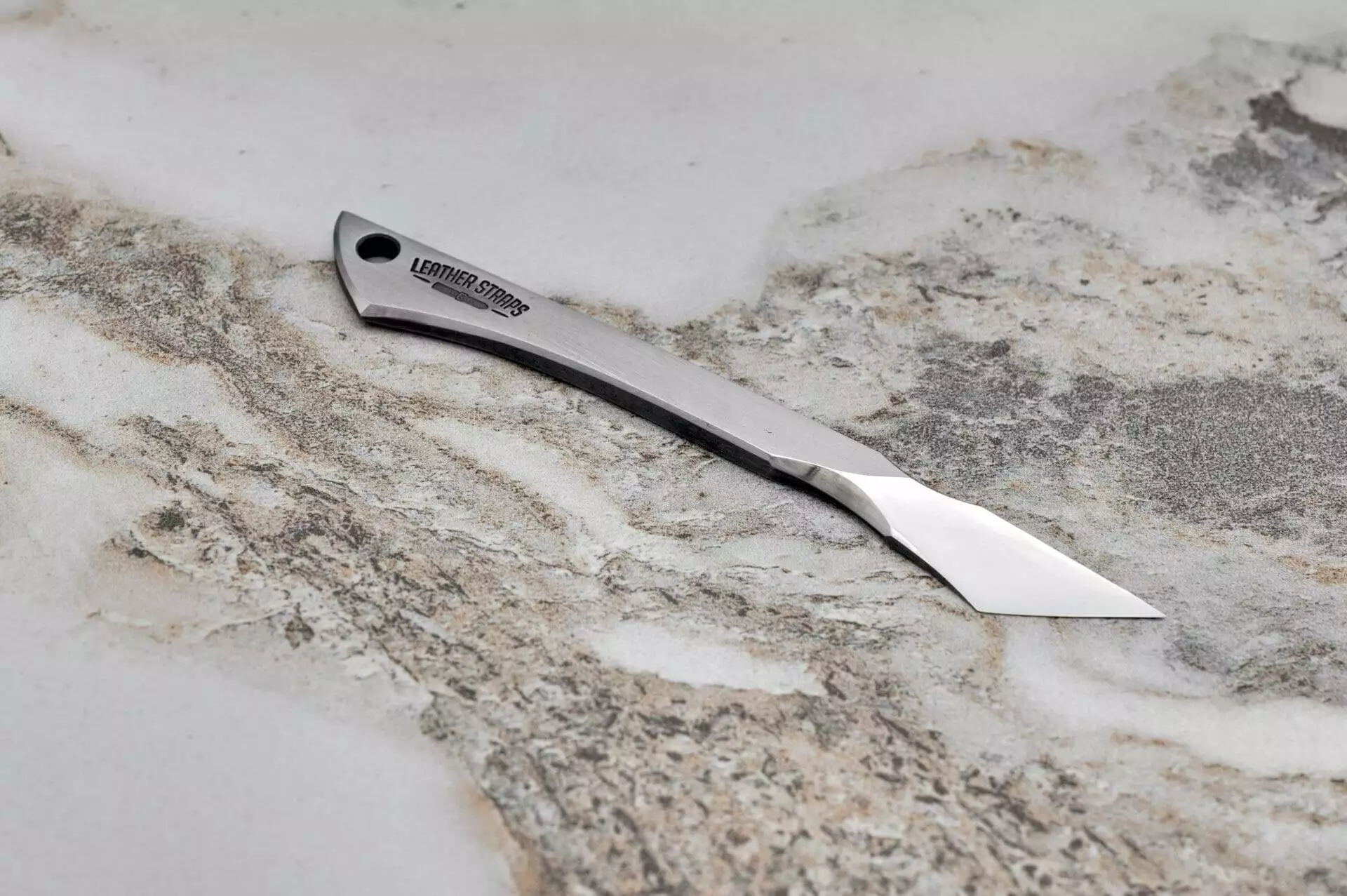 Argo Leather, Scalpel, marble surface.