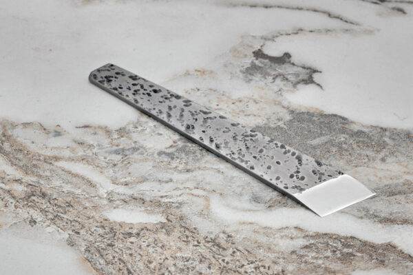 Essential Skiver, marble surface.