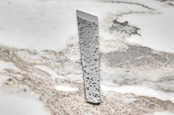 The Skiver on a marble surface.