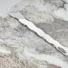 Perseus Leather Scalpel, marble surface.