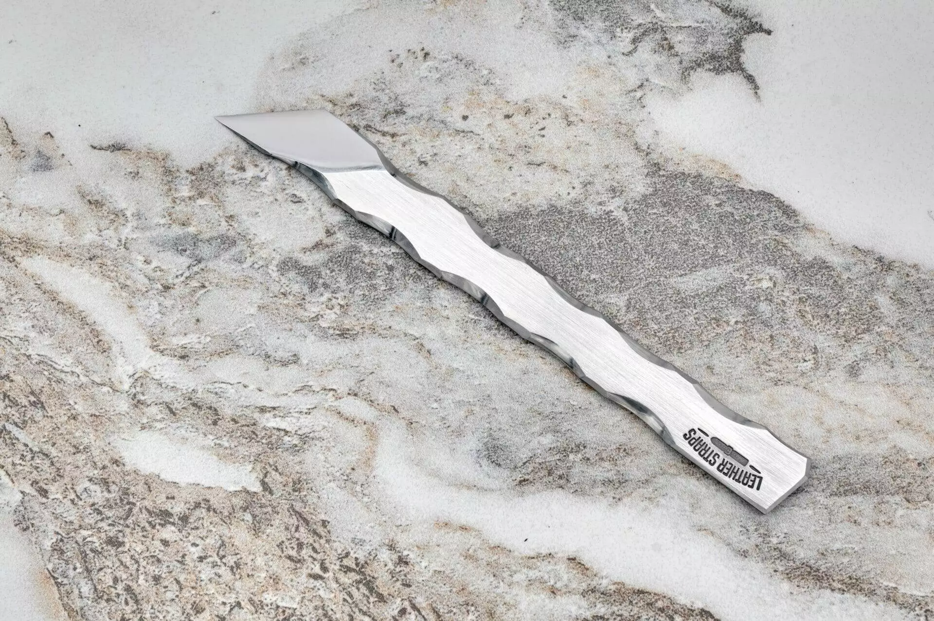 Perseus Leather Scalpel, marble surface.