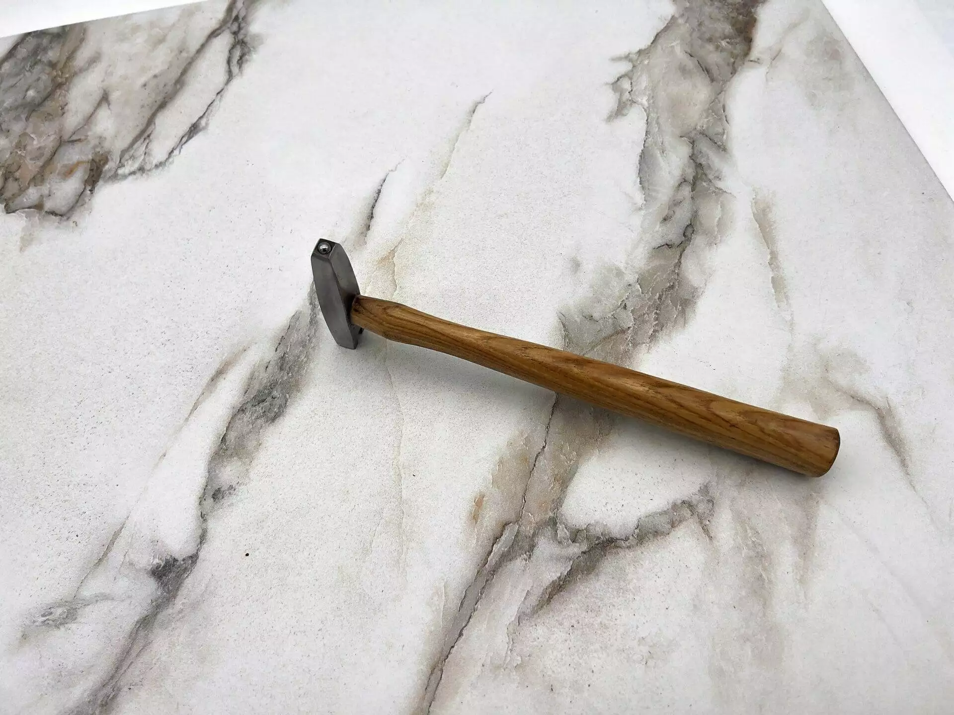 Carbide Tipped Straightening Hammer, marble countertop.