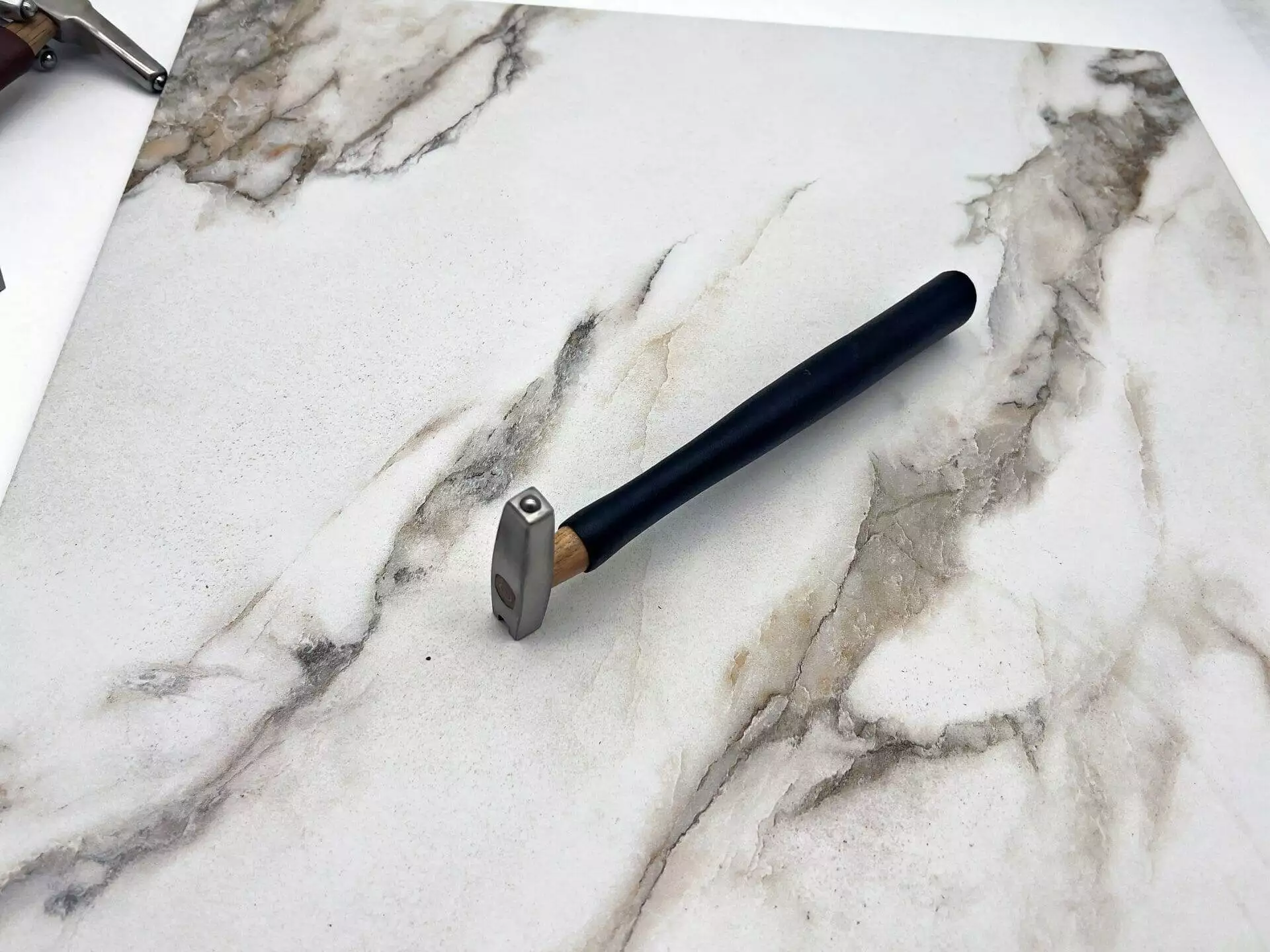 carbide tipped, straightening hammer, marble countertop.