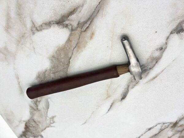 Carbide tipped hammer, marble countertop.