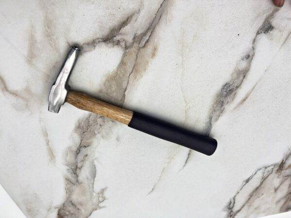 Carbide Tipped Straightening Hammer, marble countertop.