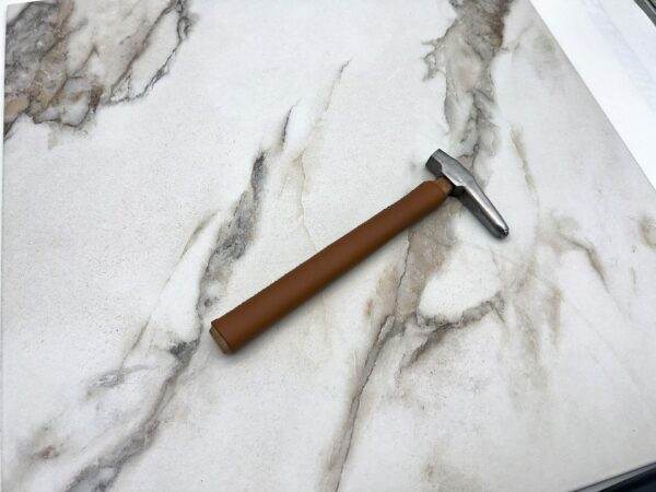 Carbide Tipped Straightening Hammer, marble countertop.