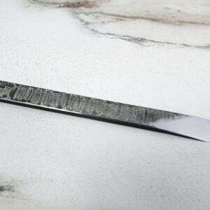 The RipTide Scalpel on a marble surface.