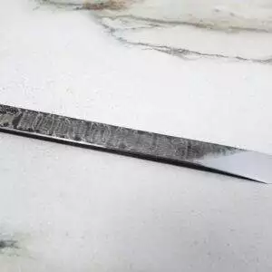 The RipTide Scalpel on a marble surface.