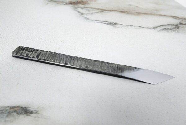 The RipTide Scalpel on a marble surface.