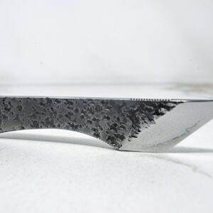 The Scorpion Skiver (45 Degree Bevel), black handle, white surface.