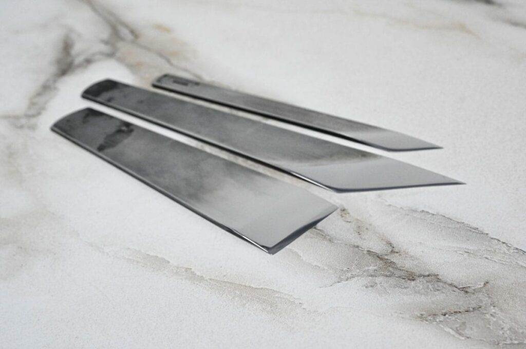 Three Leathercraft Knife Holiday Specials displayed on a marble surface, perfect for any leathercraft enthusiast looking for a holiday special.