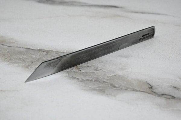 A 3 Leathercraft Knife Holiday Special placed on a luxurious marble surface.