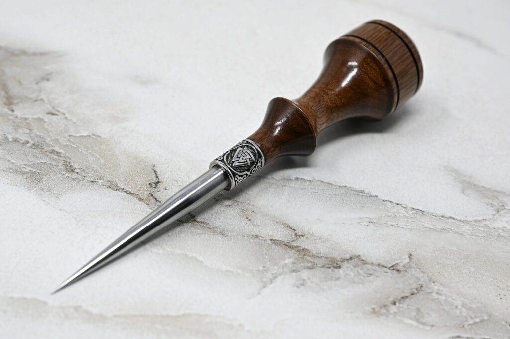 A wooden pen with a wooden handle on a marble surface. This unique 3 Leathercraft Knife Holiday Special is handcrafted using the traditional techniques of leathercraft, resulting in a stunning holiday special.