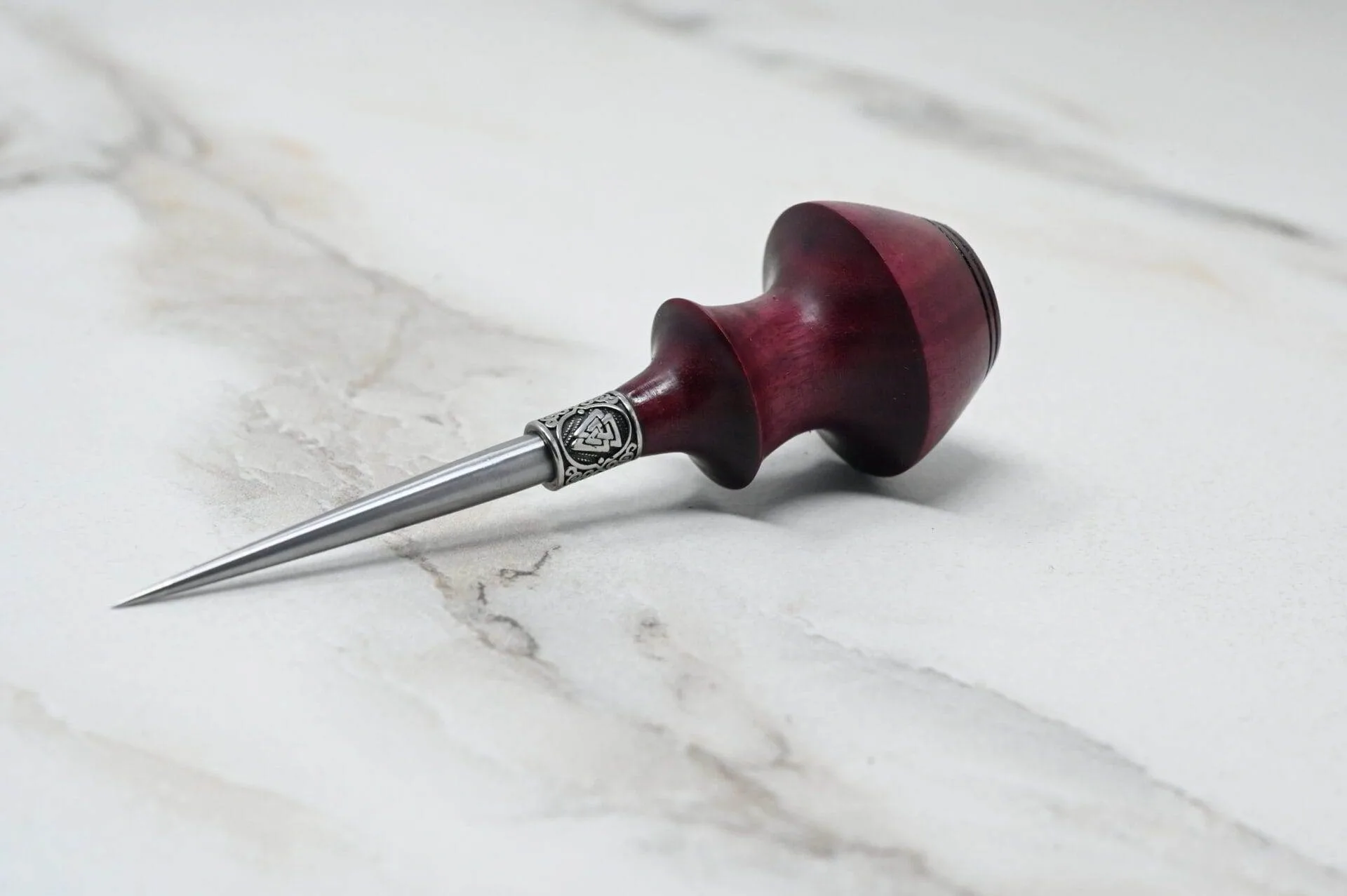 A Pre-release sale Japanese Leather Knife + Small Awl on a marble countertop.