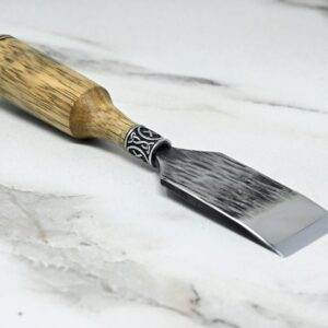 A Japanese Leather Knife on a marble surface.