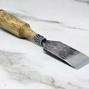 A Japanese Leather Knife on a marble surface.