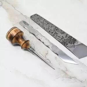 A 4th of July Leathercraft Bundle - 20 Sets Only!, a pair of metal tweezers, and a knife with a textured metal blade on a light marble surface.