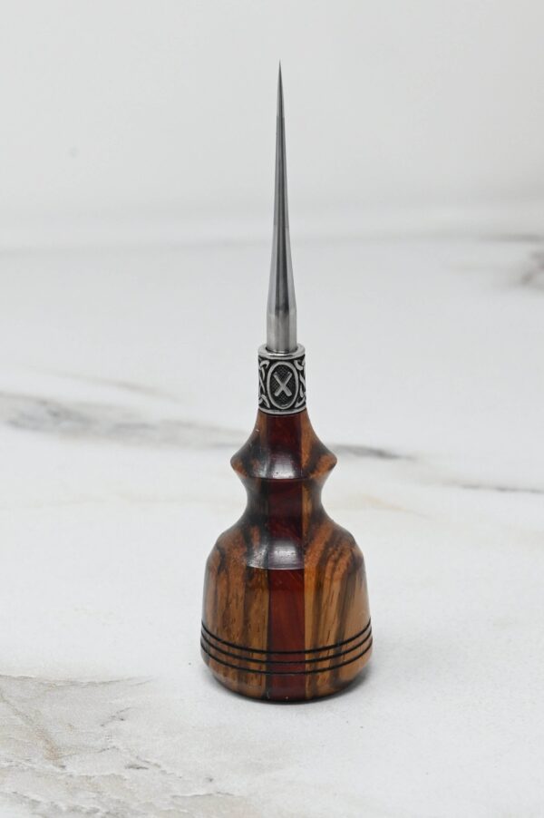 A Small Leathercraft Scratch and Poking Awls stands on a white marble surface.