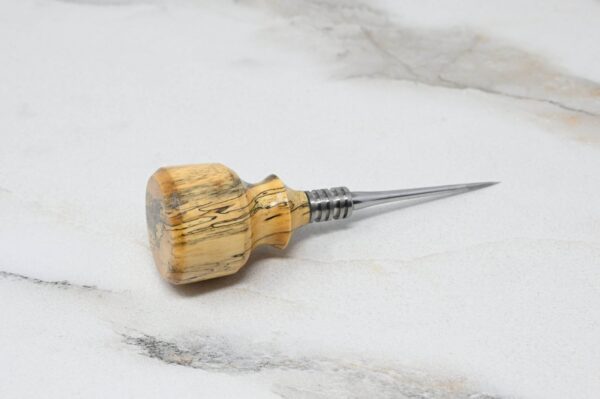 Small Leathercraft Scratch and Poking Awls with a metal pointed tip resting on a light-colored marble surface.